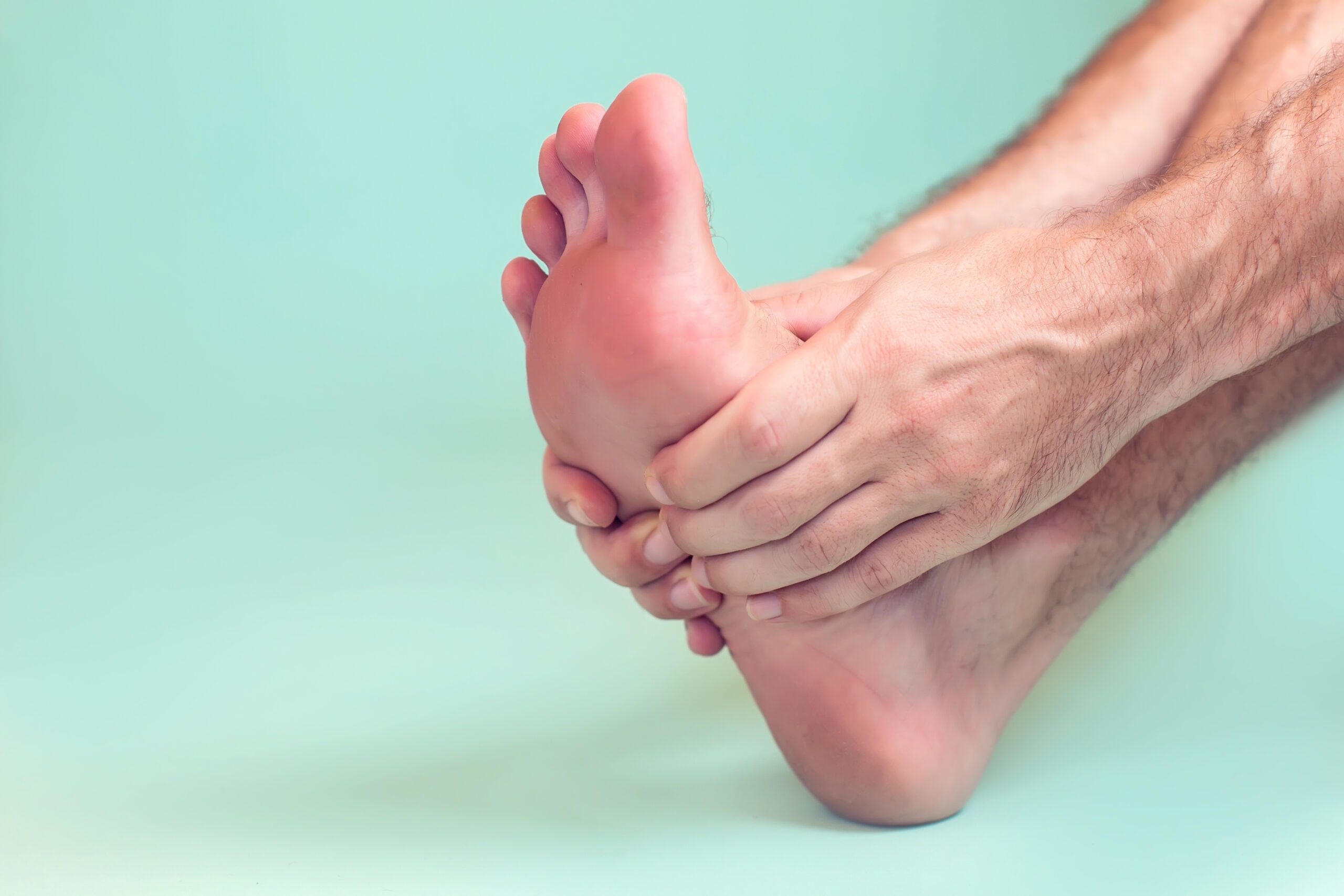 Man feels foot pain isolated. People, healthcare and medicine concept